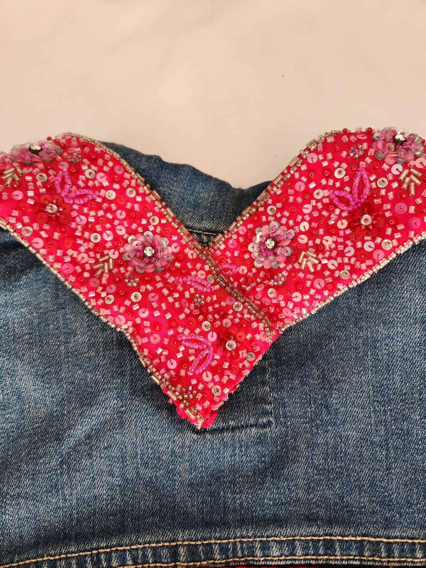 Upcycled Jean Jacket with Artisanal Beaded Flower Accents